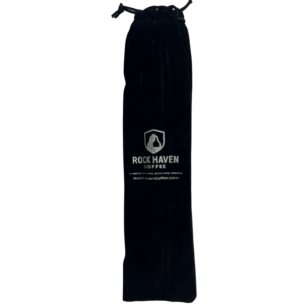 Black drawstring bag with Rock Haven Coffee logo on a white background